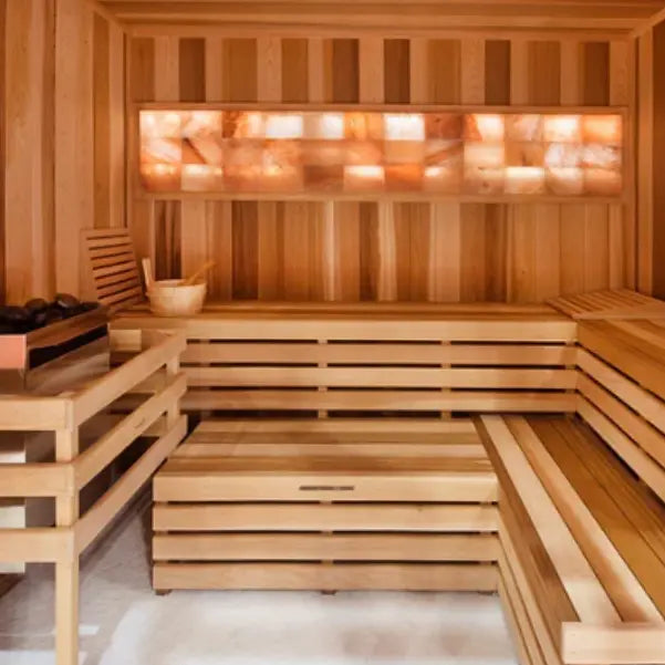A sauna interior featuring a beautifully illuminated Himalayan salt wall, enhancing relaxation and air quality.