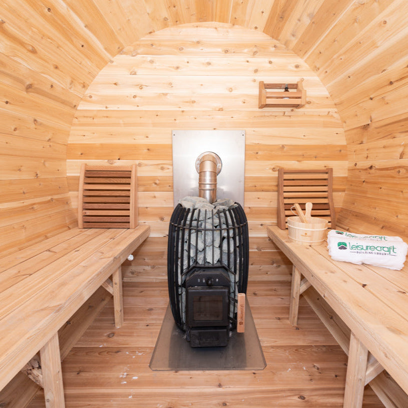 Interior view of Elation Sauna showing long bench layout and centered heater