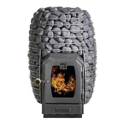 HUUM HIVE Wood Series wood-fired sauna stove with a dark metal firebox, glowing flames, and a rounded cage packed with gray stones