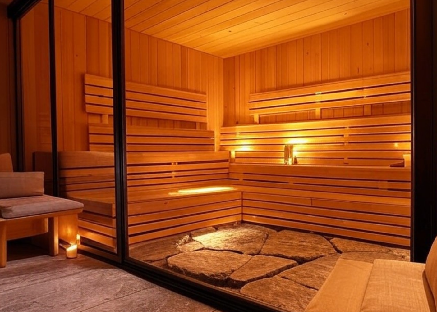 Modern Luxury Sauna with Ambient Lighting, Wooden Benches, and Stone Flooring – Relaxing Spa Experience
