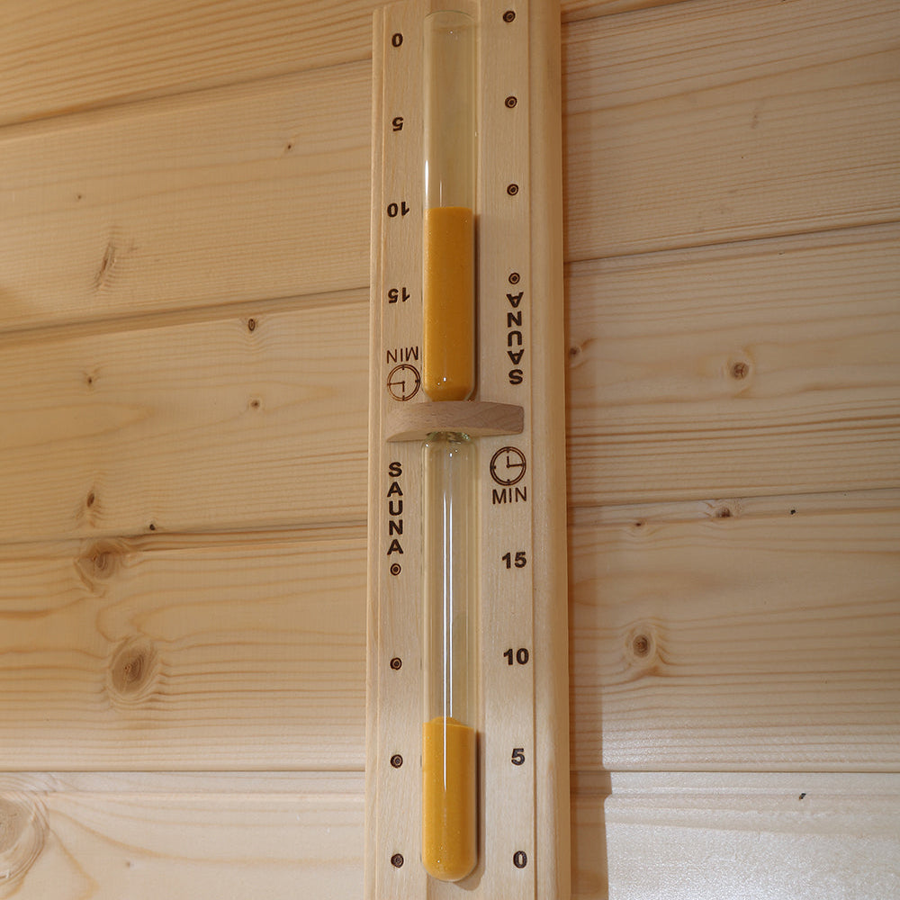 Wooden sand timer mounted vertically on sauna wall, marked for session timing