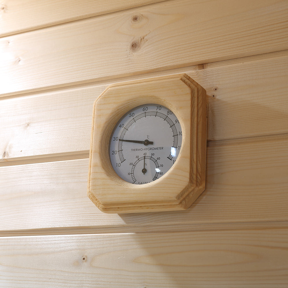 Square wood-framed sauna thermometer mounted on Canadian Hemlock wall paneling
