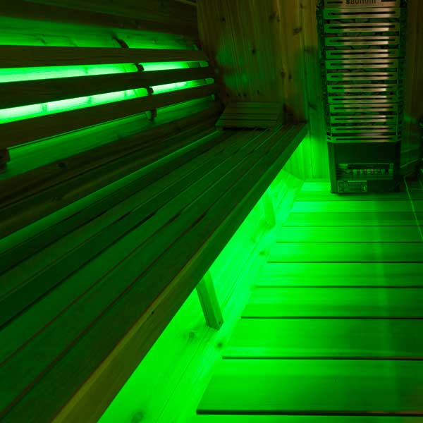 Green sauna lighting from Smartline LED strip installed beneath bench seating