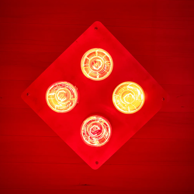 Close-up of the Sweat Box Infrared Sauna red light therapy panel with four infrared heat bulbs, designed for muscle recovery, detox, and deep heat penetration.