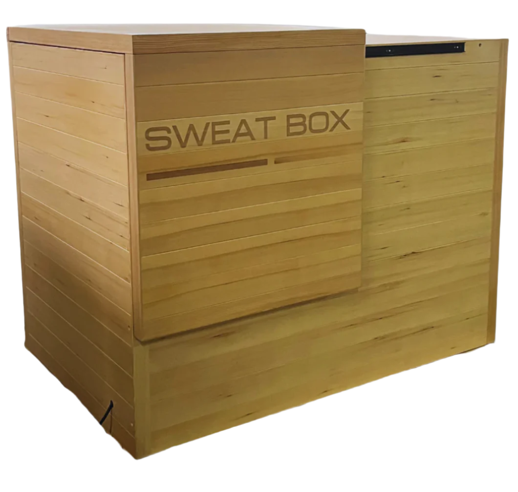 Sweat Box Infrared Sauna side view showcasing premium hemlock wood construction, compact design, and space-saving sliding door for home wellness and detox.