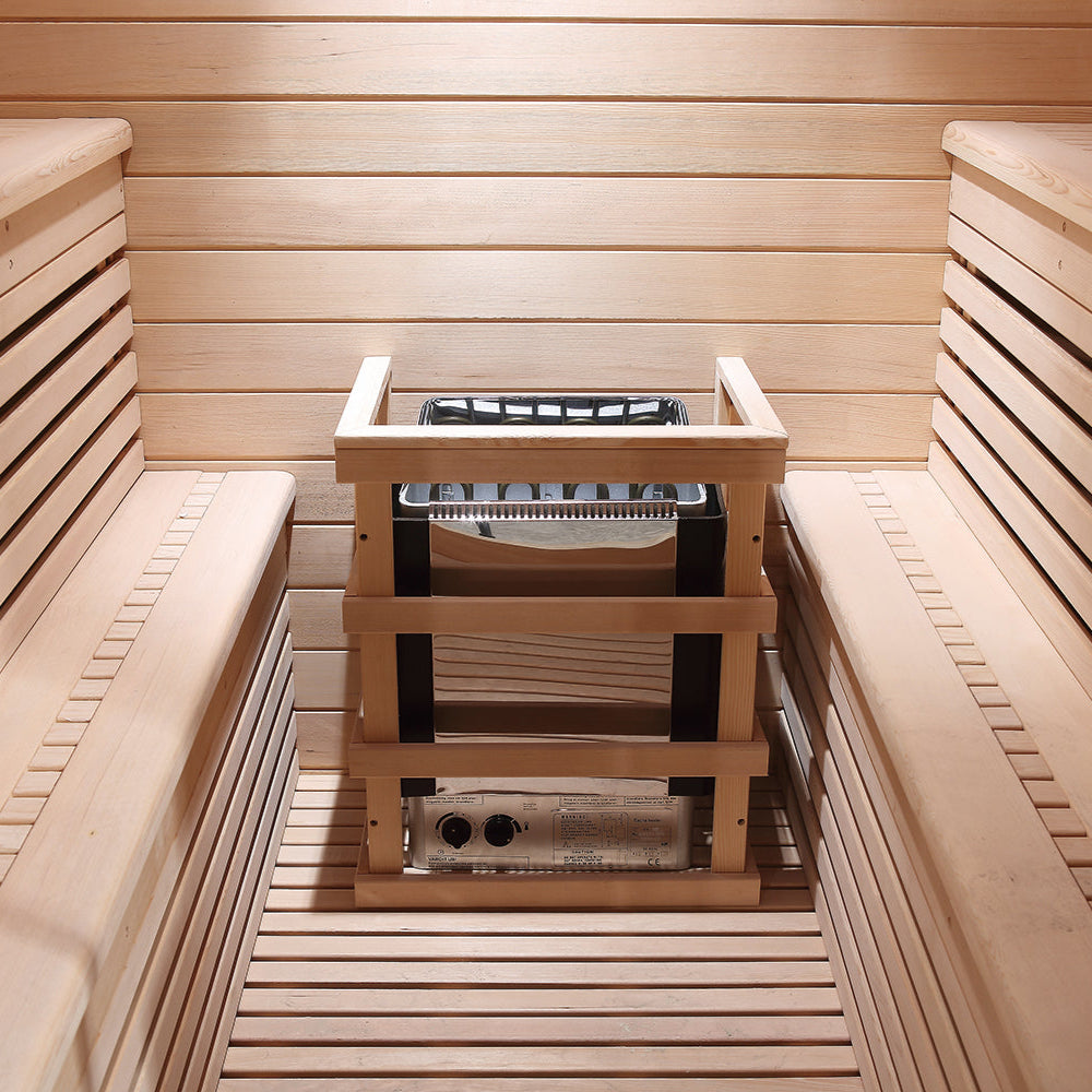 Electric sauna heater setup between benches inside Waja I002 traditional sauna