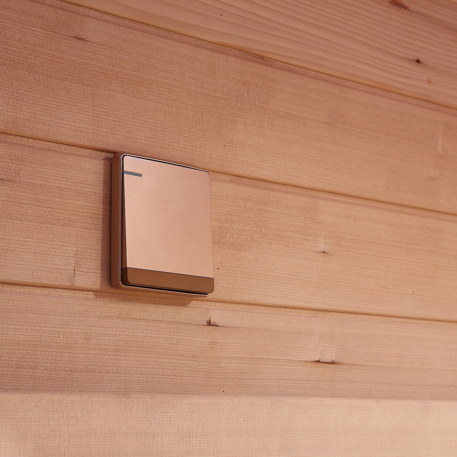 Close-up of sauna wall with mounted timer switch in Waja I002 unit