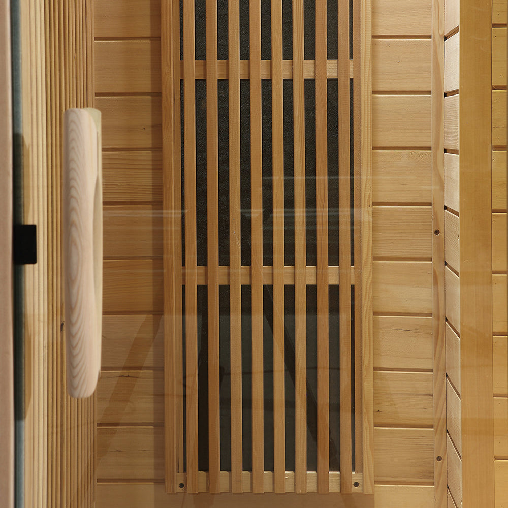 Ceramic infrared heater with wooden handle inside Canadian Hemlock sauna