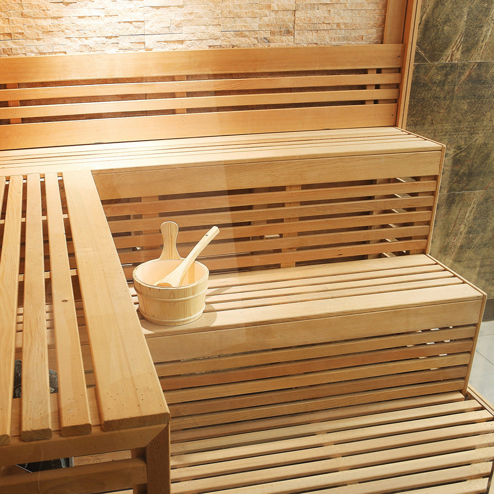 Tiered bench design in Waja WJT-I009 sauna with wide slatted seats and ladle bucket display