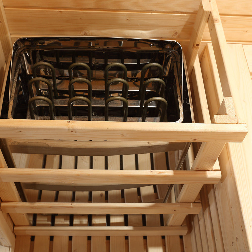 Close-up of electric sauna heater housing inside Waja WJT-I010 wooden frame