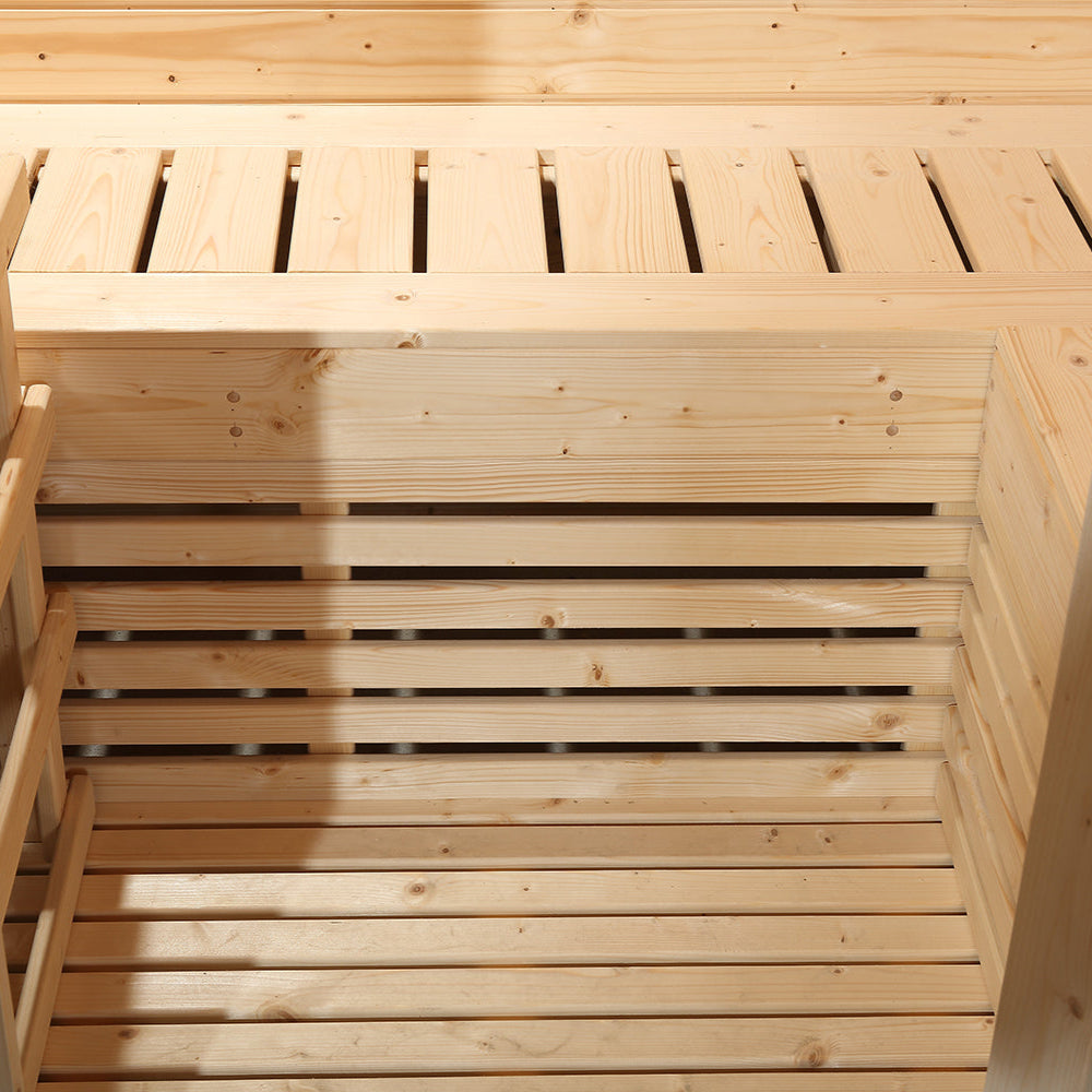 Interior view of Waja sauna showing upper and lower hemlock bench slats in compact vertical layout