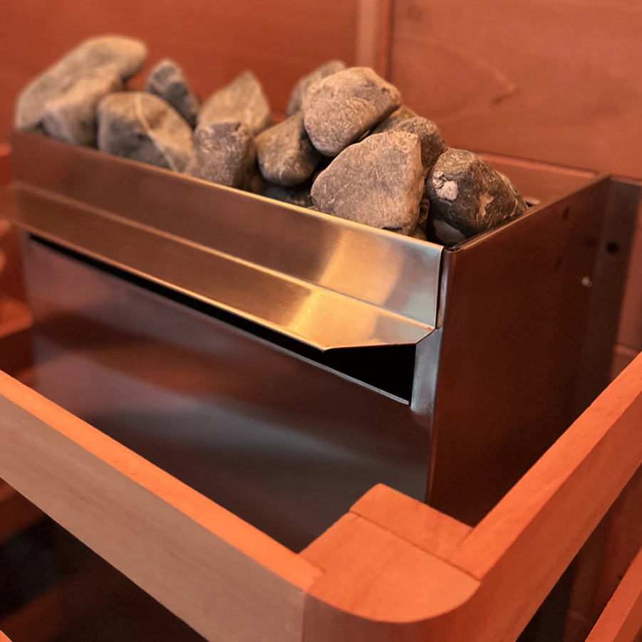 Scandia 7.5KW Electric Sauna Heater installed in a traditional sauna—stainless steel design with sauna stones for efficient and even heat distribution.