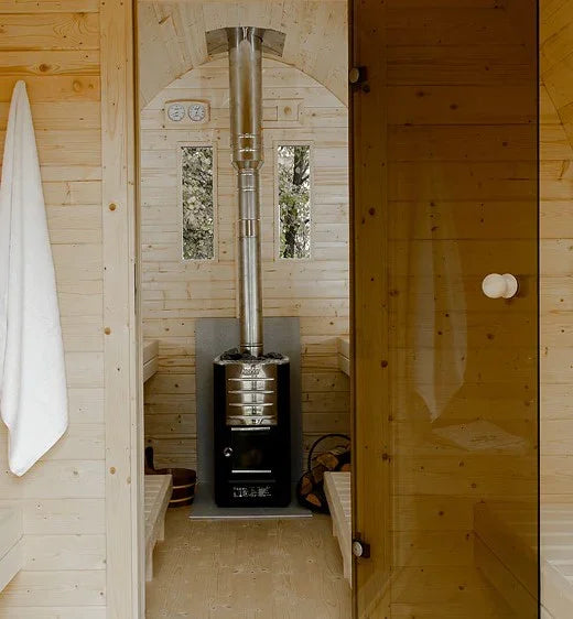 Harvia WHP1500 stainless steel chimney kit installed above a sauna wood stove inside a wood sauna room
