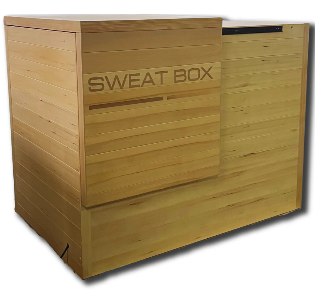 Sweat Box Infrared Sauna side view showcasing premium hemlock wood construction, compact design, and space-saving sliding door for home wellness and detox.