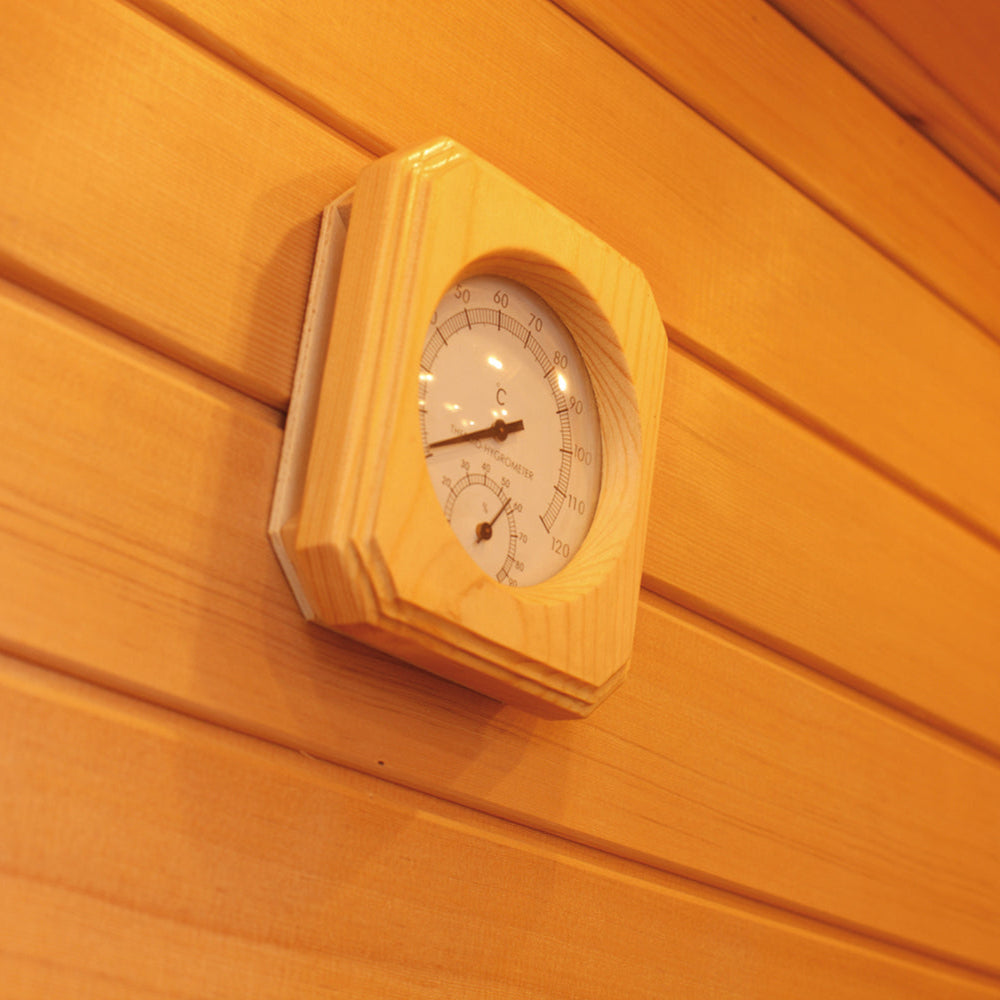 Wooden-framed thermometer mounted inside Waja sauna for temperature monitoring
