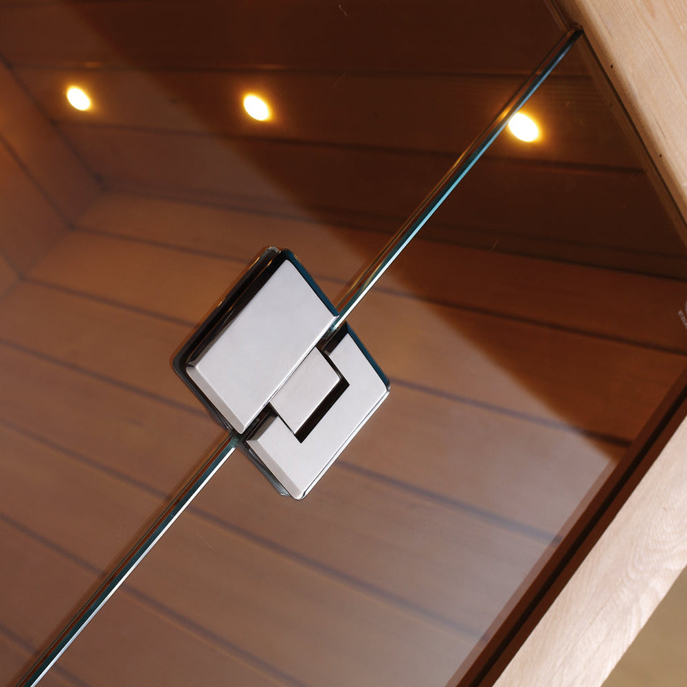 Interior view of Waja sauna glass door with chrome locking latch detail