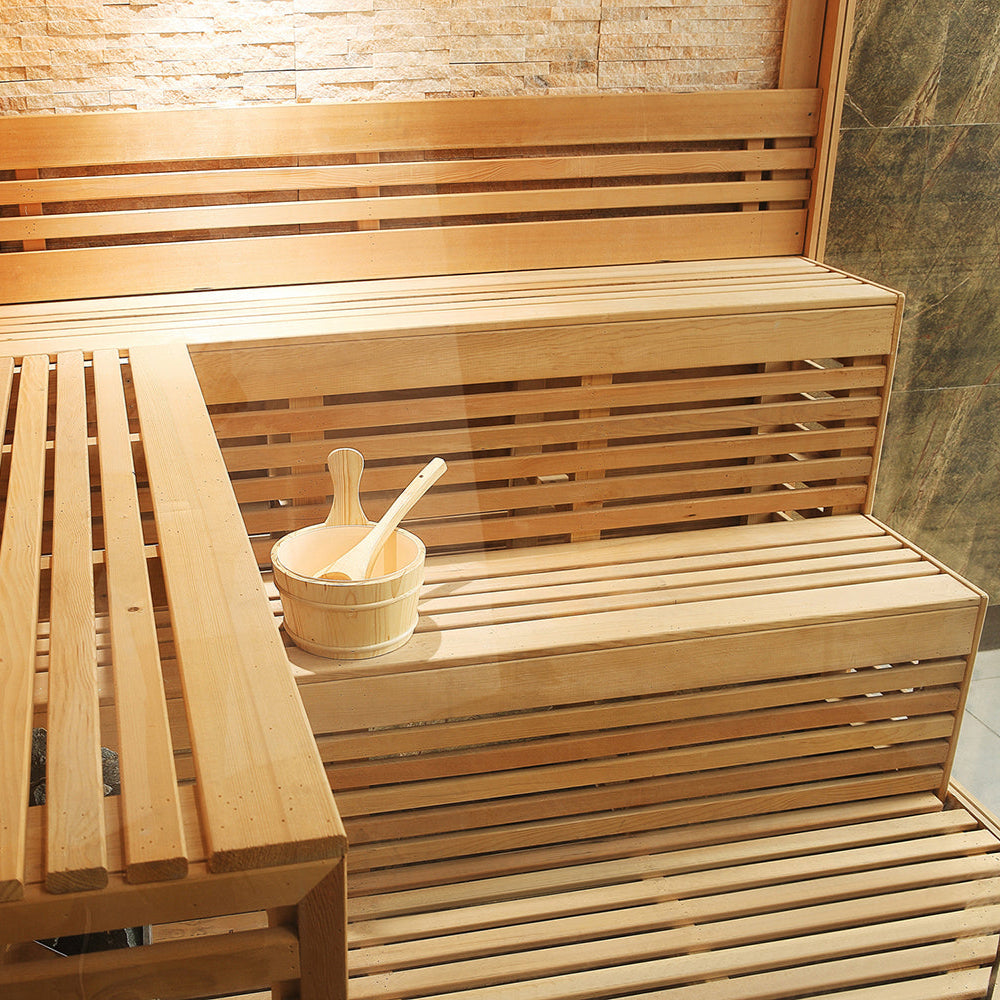 Interior view of wide horizontal benches with sauna bucket on Canadian Hemlock seating